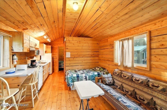 13364 Sterling Hwy, Ninilchik, AK 99639 - dining space with vaulted ceiling, wood ceiling, wooden walls, and light wood-style floors