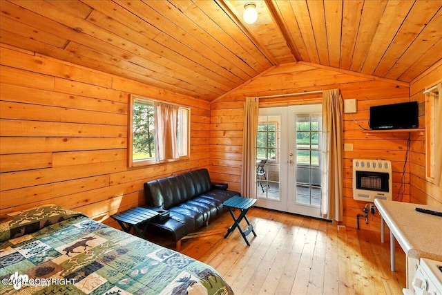 13364 Sterling Hwy, Ninilchik, AK 99639 - bedroom with vaulted ceiling, access to outside, wood walls, light wood-style floors, and wood ceiling