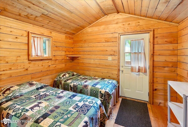 13364 Sterling Hwy, Ninilchik, AK 99639 - bedroom with lofted ceiling, wooden ceiling, wooden walls, and light wood finished floors