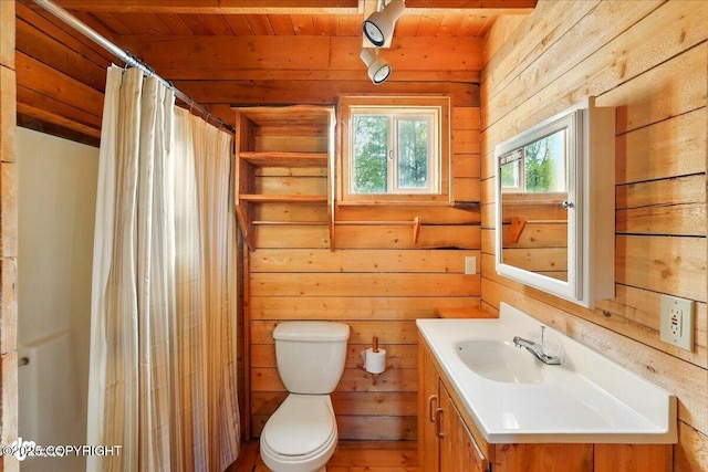 13364 Sterling Hwy, Ninilchik, AK 99639 - full bathroom with vanity, wood walls, wood ceiling, toilet, and curtained shower