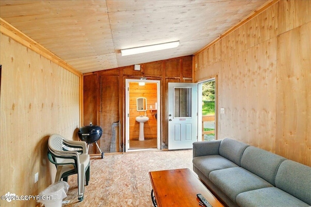 13364 Sterling Hwy, Ninilchik, AK 99639 - living area with lofted ceiling, carpet floors, and wooden walls