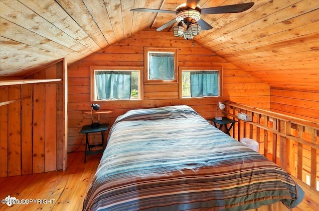 13364 Sterling Hwy, Ninilchik, AK 99639 - bedroom featuring wooden ceiling, vaulted ceiling, wood walls, light wood-style flooring, and a ceiling fan