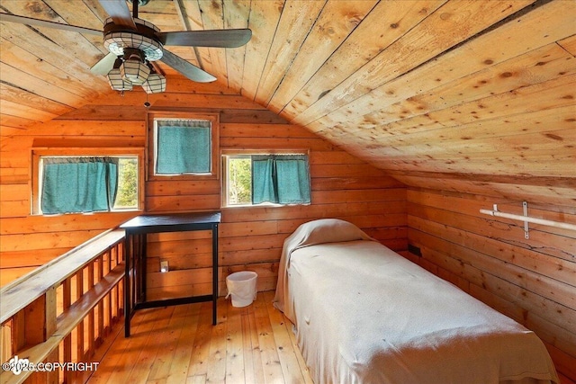 13364 Sterling Hwy, Ninilchik, AK 99639 - unfurnished bedroom featuring lofted ceiling, wooden walls, wood ceiling, and light wood-style floors