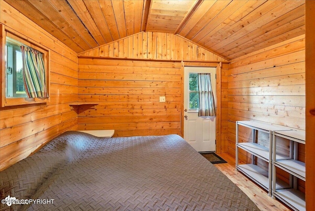 13364 Sterling Hwy, Ninilchik, AK 99639 - unfurnished bedroom featuring lofted ceiling, wooden walls, wood finished floors, and wooden ceiling
