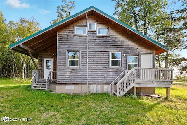 13364 Sterling Hwy, Ninilchik, AK 99639 - rear view of property featuring a lawn