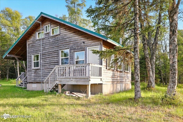 13364 Sterling Hwy, Ninilchik, AK 99639 - back of house with a wooden deck, stairs, and a yard