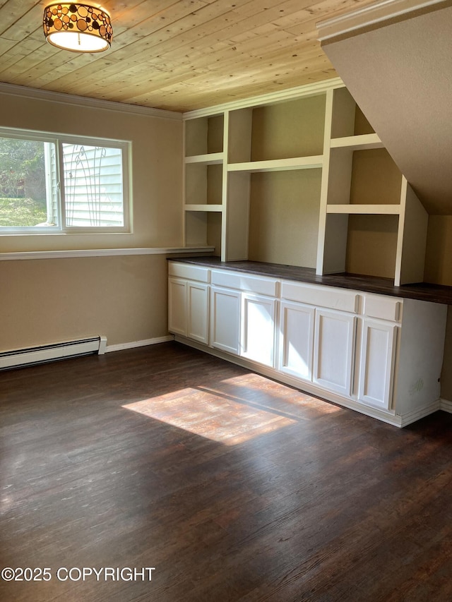 22909 Green Garden Dr, Chugiak, AK 99567 - unfurnished dining area with baseboard heating, wood ceiling, baseboards, and dark wood-style flooring