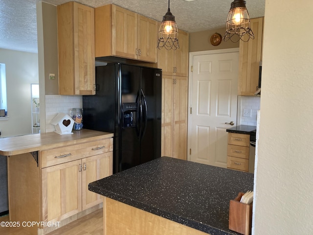 22909 Green Garden Dr, Chugiak, AK 99567 - kitchen featuring black fridge, a textured ceiling, backsplash, and light brown cabinets