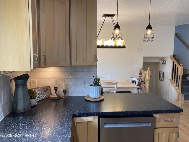 22909 Green Garden Dr, Chugiak, AK 99567 - kitchen with dishwasher, backsplash, a peninsula, a textured ceiling, and decorative light fixtures