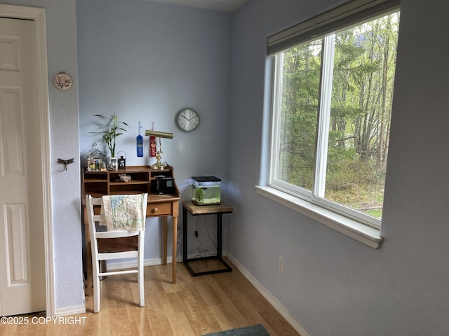 22909 Green Garden Dr, Chugiak, AK 99567 - office space with light wood finished floors, healthy amount of natural light, and baseboards