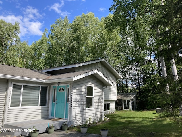 22909 Green Garden Dr, Chugiak, AK 99567 - view of front of house with a front yard