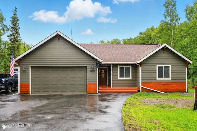 2700 S Hatcher Pass St, Wasilla, AK 99623 - ranch-style house with driveway, an attached garage, a shingled roof, and a porch