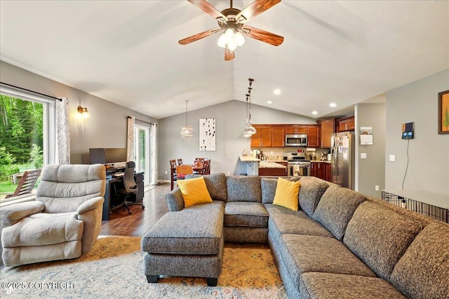 2700 S Hatcher Pass St, Wasilla, AK 99623 - living room with wood finished floors, healthy amount of natural light, lofted ceiling, a ceiling fan, and recessed lighting