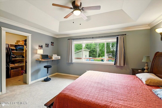 2700 S Hatcher Pass St, Wasilla, AK 99623 - bedroom featuring a raised ceiling, carpet, a walk in closet, ornamental molding, and baseboards