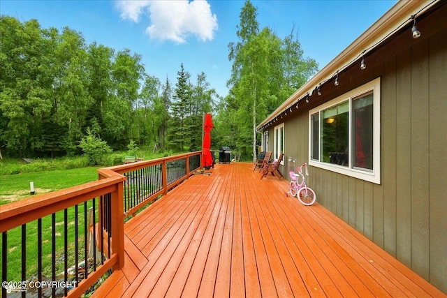 2700 S Hatcher Pass St, Wasilla, AK 99623 - wooden deck featuring a yard and view of scattered trees