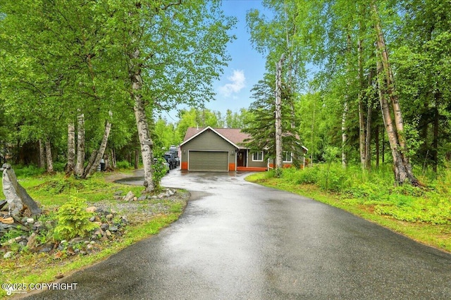 2700 S Hatcher Pass St, Wasilla, AK 99623 - view of front of house with driveway and an attached garage