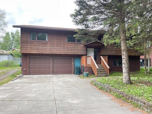 7700 E 32nd Ave, Anchorage, AK 99504 - raised ranch with a garage and concrete driveway