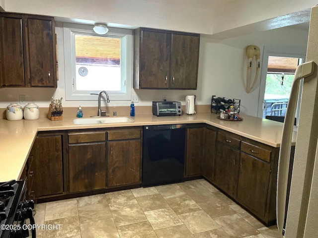 7700 E 32nd Ave, Anchorage, AK 99504 - kitchen with black appliances, a sink, dark brown cabinetry, and light countertops