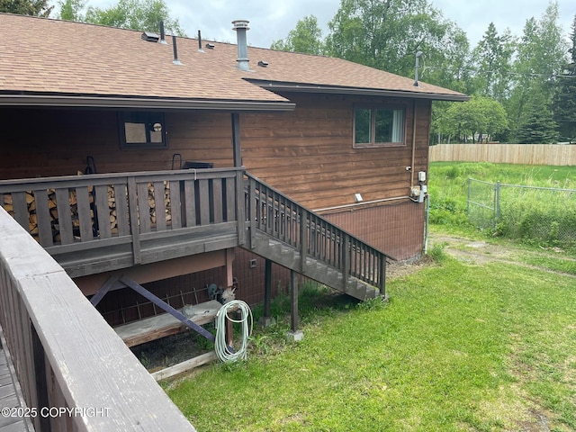 7700 E 32nd Ave, Anchorage, AK 99504 - back of house featuring a shingled roof and a wooden deck