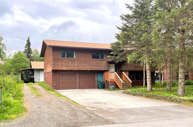 7700 E 32nd Ave, Anchorage, AK 99504 - view of front of property with driveway and a garage