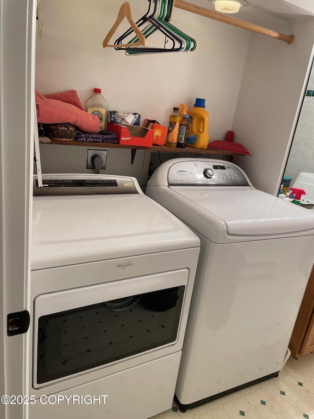 7700 E 32nd Ave, Anchorage, AK 99504 - washroom with washer and clothes dryer and light flooring