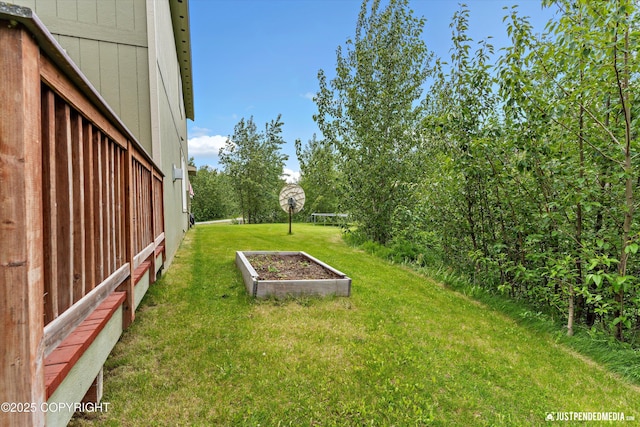 542 S Tender Arctic Dr, Palmer, AK 99645 - view of grassy yard with a vegetable garden