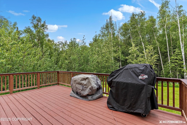 542 S Tender Arctic Dr, Palmer, AK 99645 - wooden deck with grilling area and a view of trees