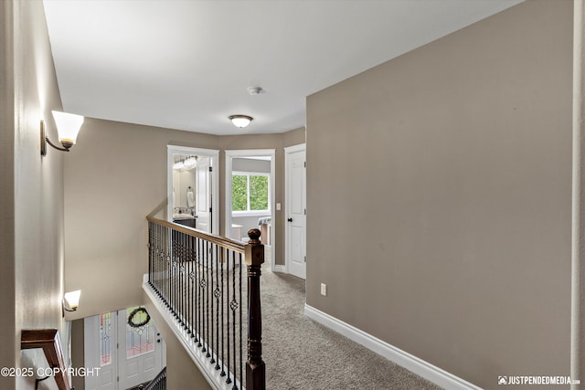 542 S Tender Arctic Dr, Palmer, AK 99645 - hall with carpet flooring, baseboards, and an upstairs landing