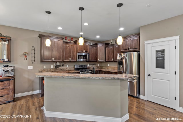 542 S Tender Arctic Dr, Palmer, AK 99645 - kitchen featuring appliances with stainless steel finishes, dark brown cabinetry, dark wood finished floors, baseboards, and recessed lighting