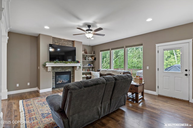 542 S Tender Arctic Dr, Palmer, AK 99645 - living room featuring a fireplace, ceiling fan, dark wood-style floors, baseboards, and recessed lighting
