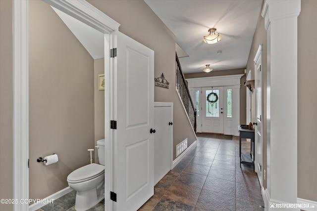 542 S Tender Arctic Dr, Palmer, AK 99645 - entryway featuring baseboards, stone tile flooring, and stairs