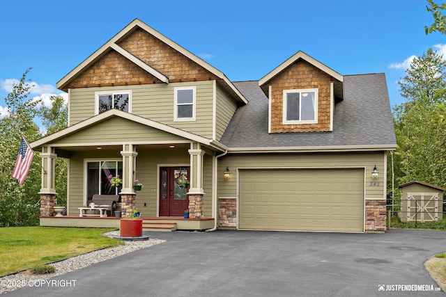 542 S Tender Arctic Dr, Palmer, AK 99645 - craftsman inspired home with a porch, roof with shingles, stone siding, driveway, and a garage