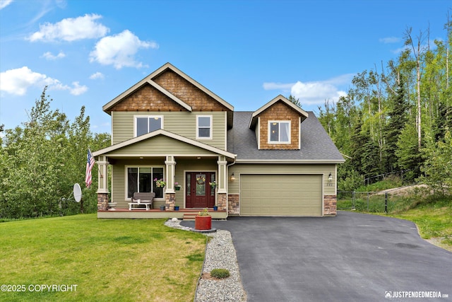 542 S Tender Arctic Dr, Palmer, AK 99645 - craftsman-style house with a porch, asphalt driveway, a shingled roof, stone siding, and an attached garage