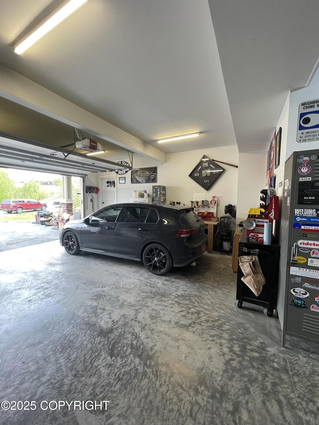 542 S Tender Arctic Dr, Palmer, AK 99645 - garage featuring a garage door opener