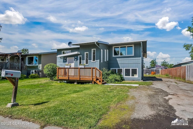 2105 W 47th Ave, Anchorage, AK 99517 - view of front of property with a deck and asphalt driveway