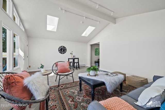 2105 W 47th Ave, Anchorage, AK 99517 - living room featuring a skylight, rail lighting, vaulted ceiling, carpet flooring, and a baseboard heating unit