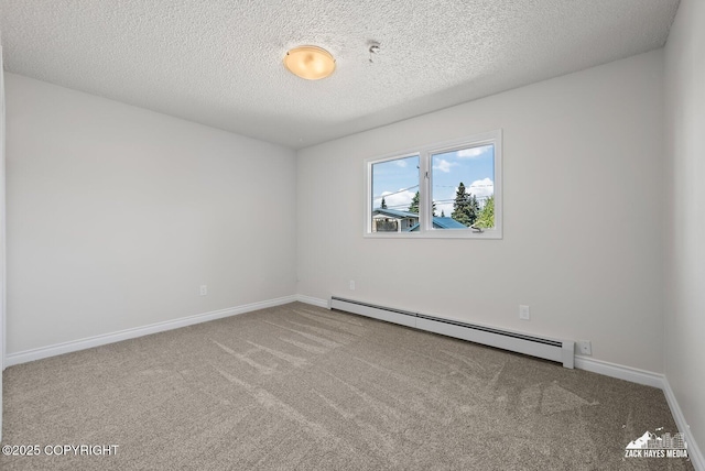2105 W 47th Ave, Anchorage, AK 99517 - carpeted empty room with a baseboard heating unit and a textured ceiling