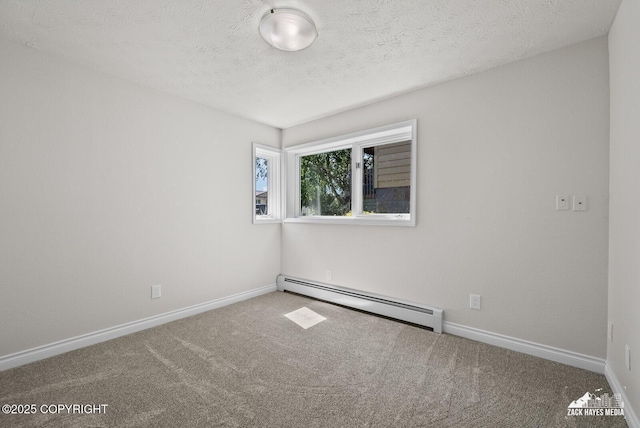 2105 W 47th Ave, Anchorage, AK 99517 - empty room featuring baseboard heating, carpet floors, and a textured ceiling