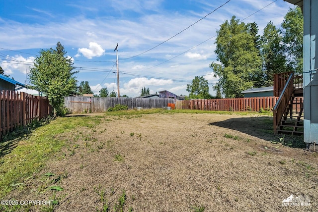 2105 W 47th Ave, Anchorage, AK 99517 - fenced backyard with stairway