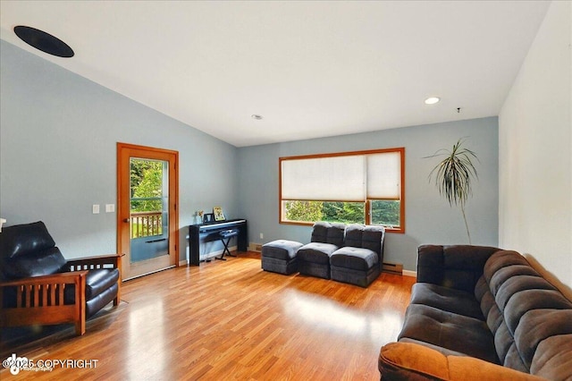 4085 Calhoun St, Homer, AK 99603 - living area featuring wood finished floors, baseboard heating, recessed lighting, lofted ceiling, and baseboards
