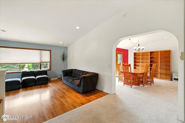 4085 Calhoun St, Homer, AK 99603 - living room with arched walkways, a chandelier, wood finished floors, recessed lighting, and baseboards