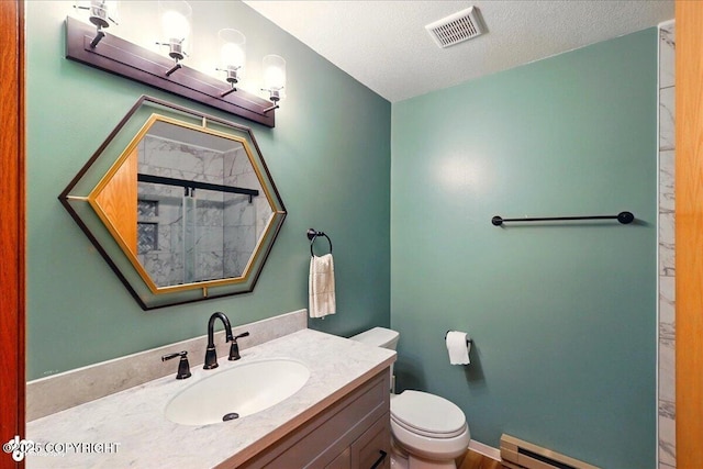 4085 Calhoun St, Homer, AK 99603 - full bathroom with a baseboard radiator, toilet, vanity, a shower, and a textured ceiling