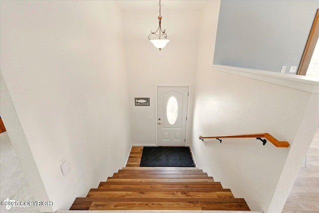 4085 Calhoun St, Homer, AK 99603 - stairs featuring wood finished floors and a towering ceiling