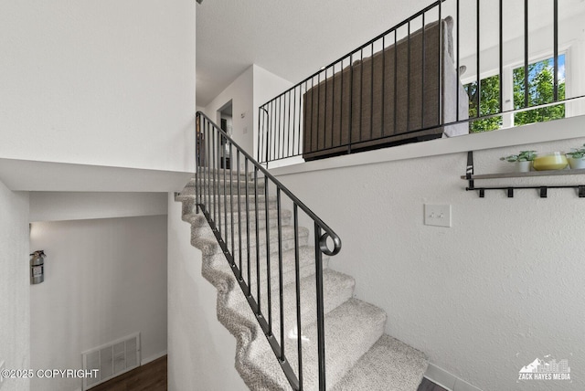 20213 David Ave, Eagle River, AK 99577 - stairway featuring wood finished floors and baseboards