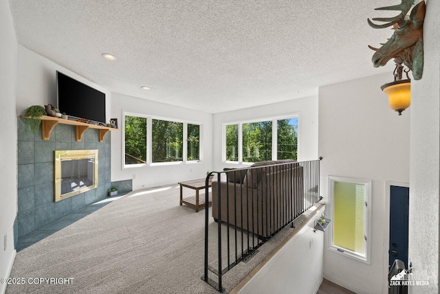 20213 David Ave, Eagle River, AK 99577 - living area featuring a textured ceiling, a fireplace, and recessed lighting