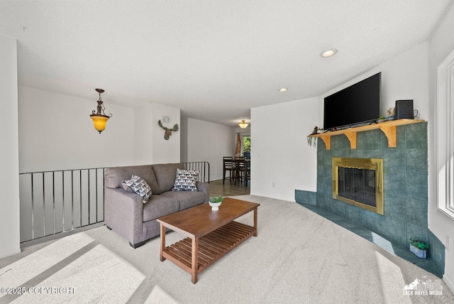 20213 David Ave, Eagle River, AK 99577 - living room with carpet, recessed lighting, and a tile fireplace