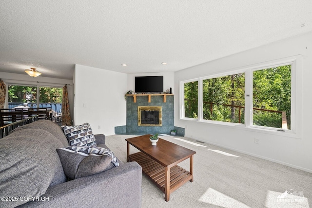 20213 David Ave, Eagle River, AK 99577 - carpeted living area featuring a textured ceiling, a fireplace, and recessed lighting