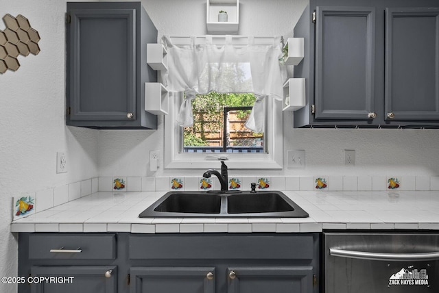 20213 David Ave, Eagle River, AK 99577 - kitchen featuring stainless steel dishwasher, gray cabinets, and a textured wall