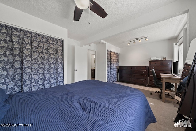 20213 David Ave, Eagle River, AK 99577 - bedroom featuring a textured ceiling, ceiling fan, carpet flooring, and a desk