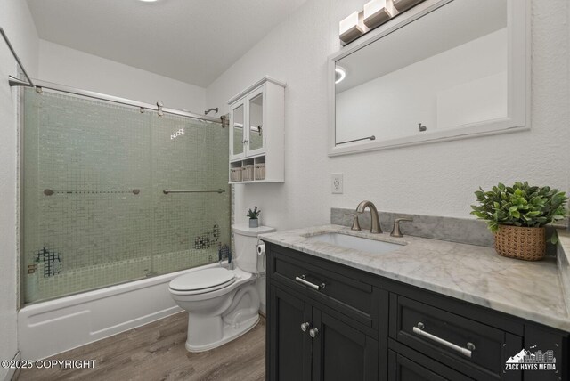 20213 David Ave, Eagle River, AK 99577 - full bathroom with wood finished floors, vanity, and bath / shower combo with glass door